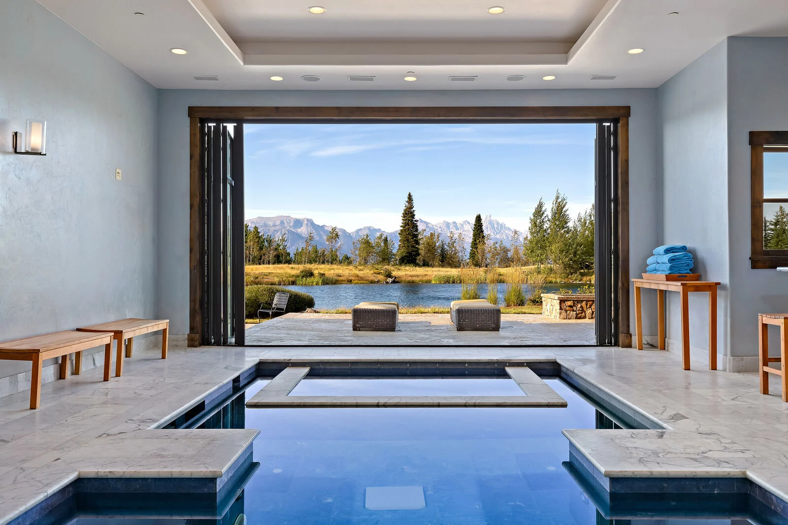 A view of an open spa space over looking the lake and mountains at Abode jackson hole vacation rentals