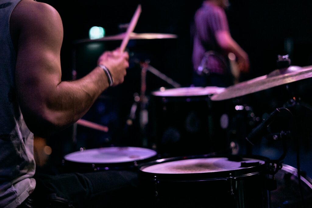 A drummer with a live band